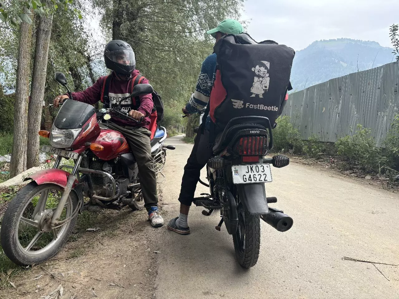  Delivery riders start their day by riding on two-wheelers early in the morning to reach the remote villages in South Kashmirs Anantnag district to deliver goods.